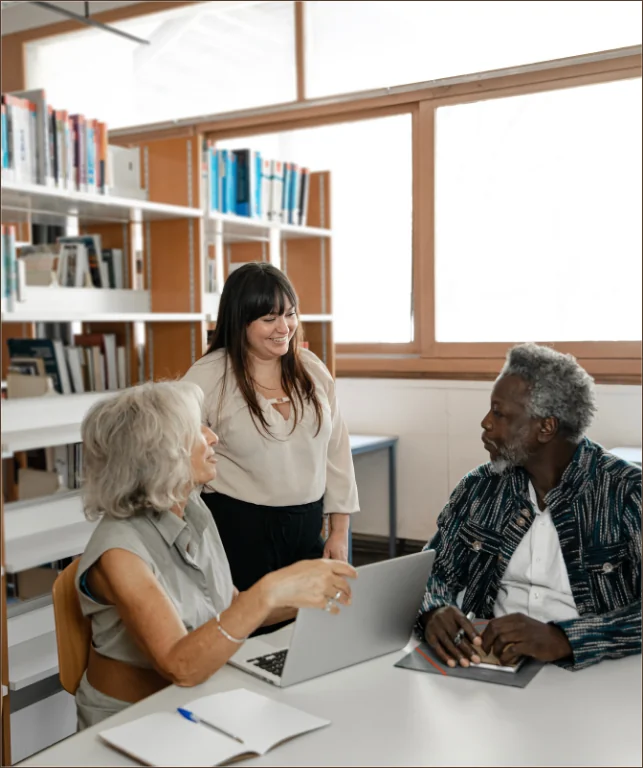 People meeting and exchanging ideas in a library