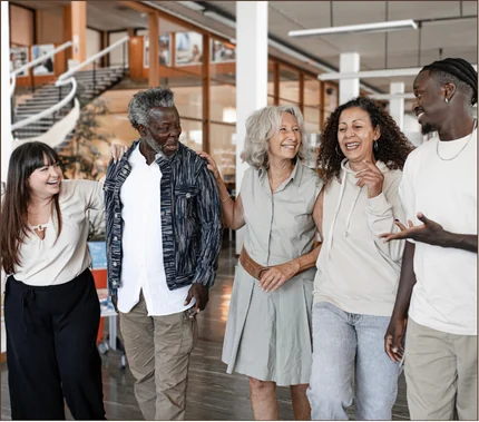A group of community members talking together in a library
